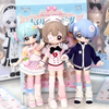 Three articulated BJD collectible figurines in pink and blue outfits displayed in their packaging.
