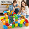 A colorful 3D cube assembly track set with wooden blocks and a rechargeable train engine being built by a family.