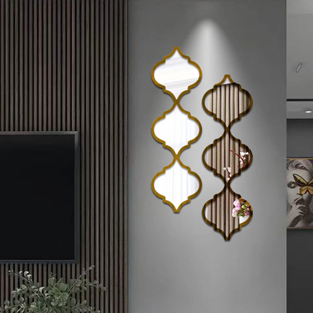 Moroccan-inspired decorative mirror wall stickers featuring gold-edged, ornate mirrors mounted on a gray wall.