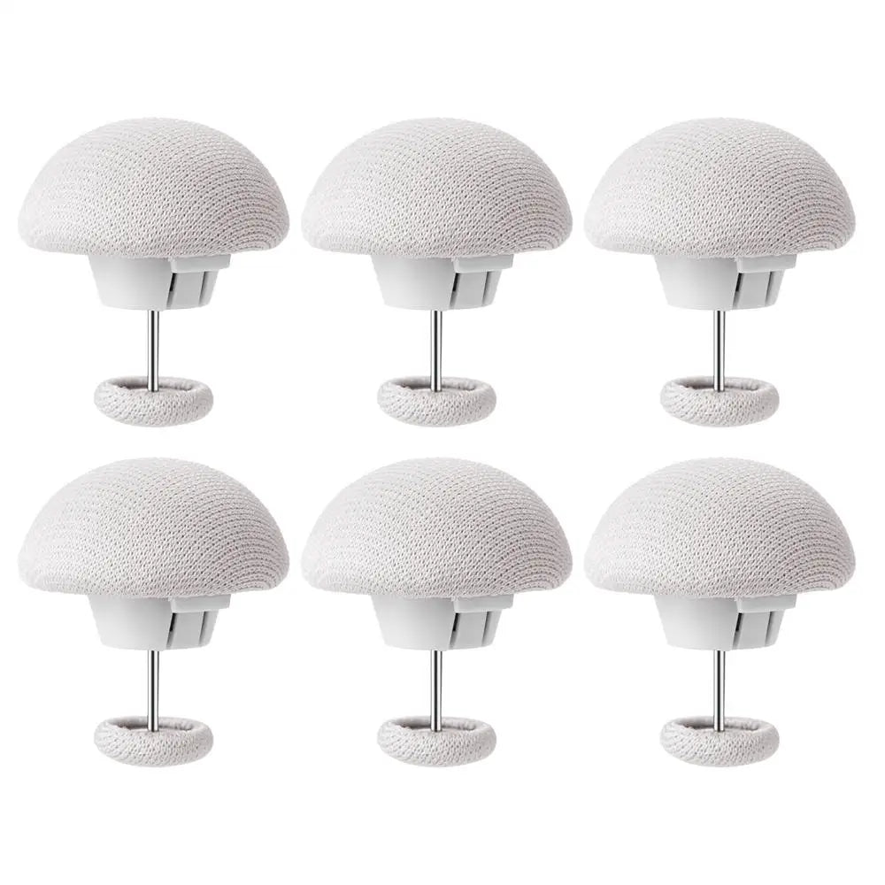 A set of six white non-slip duvet cover clips, each with a dome-shaped head and a metal stand.