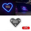 A heart-shaped ambient light featuring a silver rectangle, shown in glowing blue and purple light on a car interior.