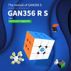 A close-up view of a GAN356 RS cube, showing its orange and white magnetic layers, surrounded by other cube components.
