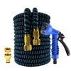 A coiled black garden hose with gold fittings and a blue high-pressure spray nozzle.