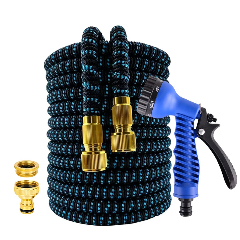 A coiled black garden hose with gold fittings and a blue high-pressure spray nozzle.
