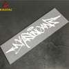 A white wildstyle graffiti decal on a gray surface, likely for a motorcycle helmet.