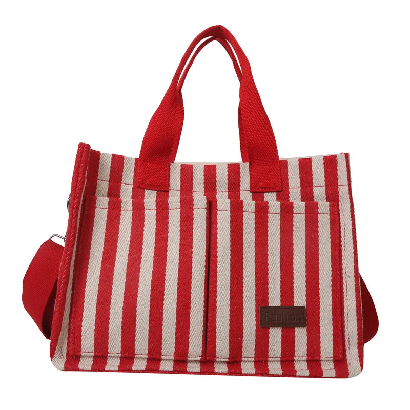 A red and white striped canvas tote bag with inner pockets.