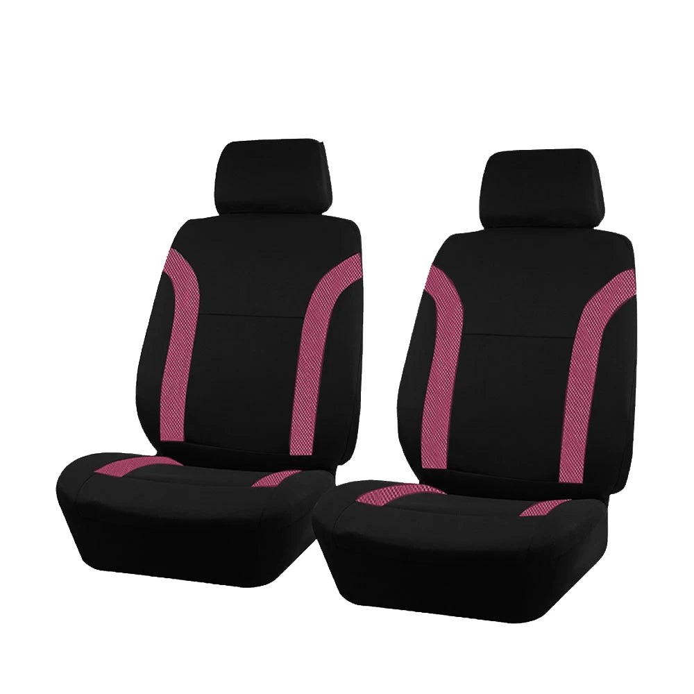 A set of black car seat covers featuring pink stitching on a black fabric.