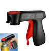 Black and red ergonomic spray paint gun handle with a red grip and a black cap.
