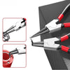 A pair of silver and red dual-use circlip pliers shown against a dark background.