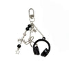 Silver metal music note charms hanging from a chain suitable for bags, keys, or phones