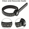 A black ring sizing tool with a magnifying ruler and adjustable measuring scale shown in various views.
