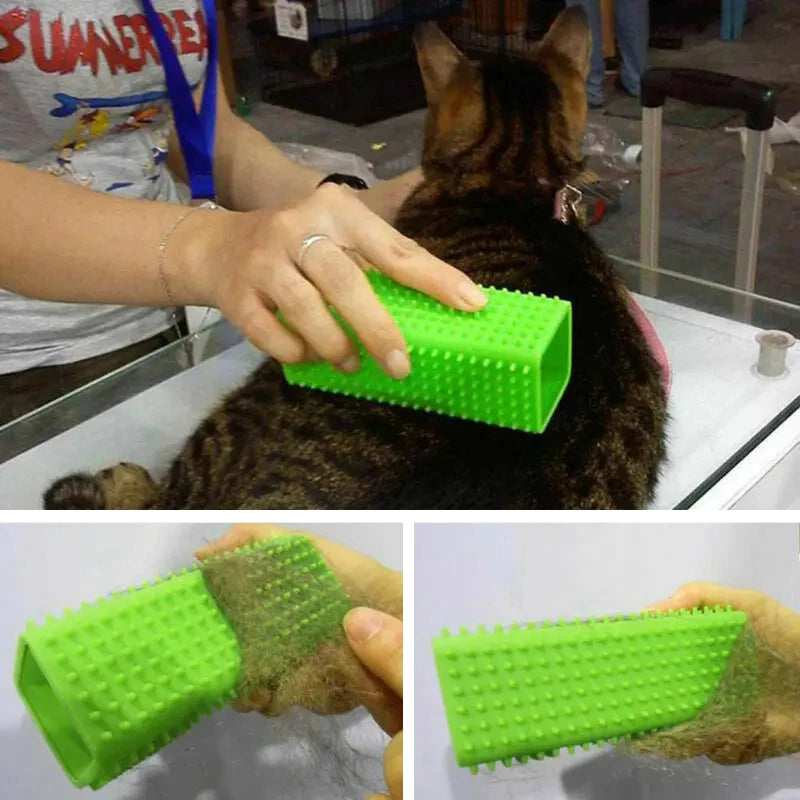 A hand is using a green silicone pet hair remover brush on a cat's fur.