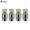 A set of four color-coded tire pressure indicator valve caps with silver metal bodies.