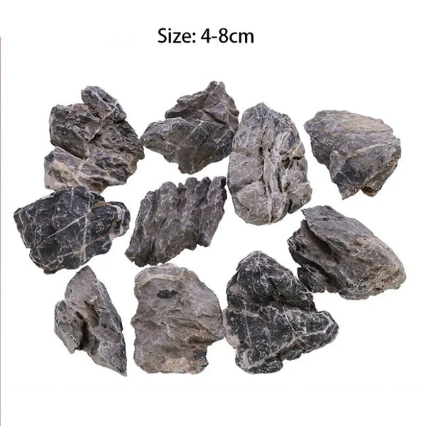 A collection of natural grey aquarium stones ranging in size from 4 to 8 centimeters.