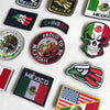A collection of tactical patches featuring the Mexican flag, eagle, and skull design.