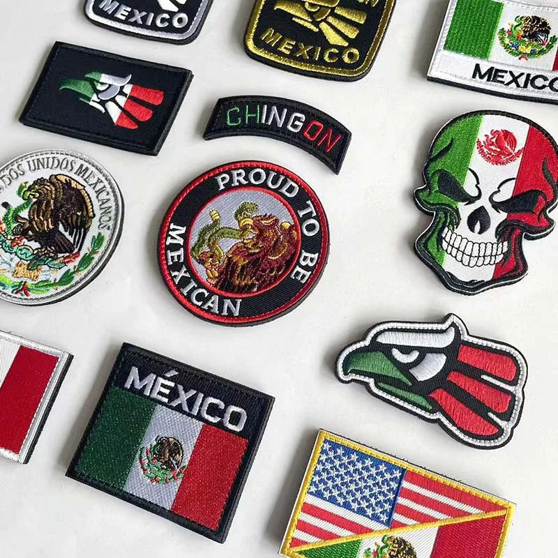 A collection of tactical patches featuring the Mexican flag, eagle, and skull design.