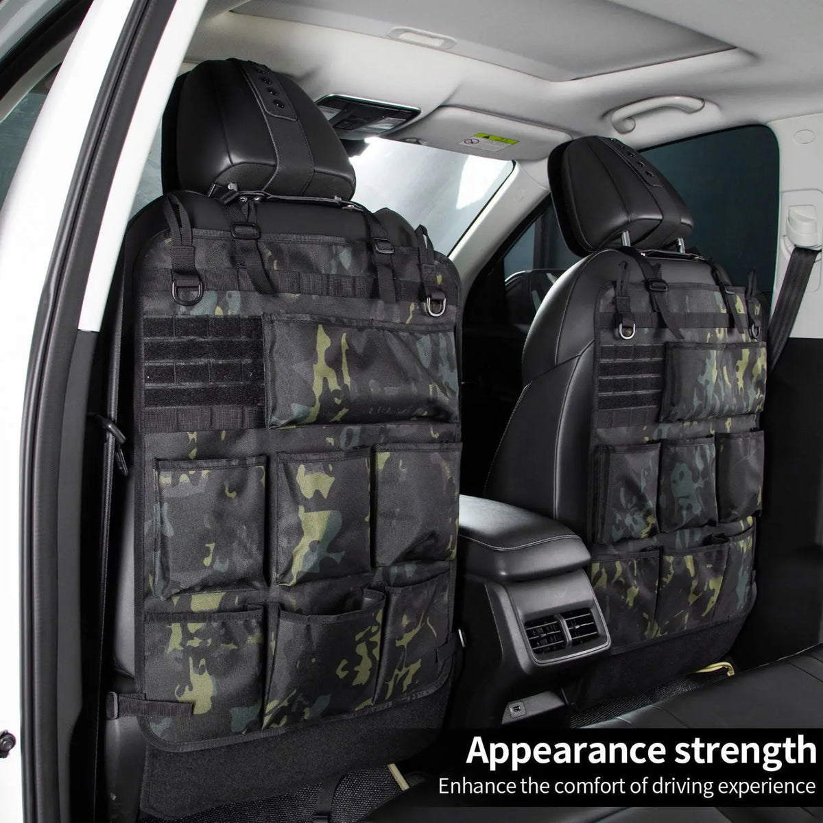 A tactical seat back organizer with seven pockets in a camouflage pattern installed in a car seat.