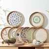 Handcrafted rattan serving tray with mother of pearl inlay featuring a decorative floral pattern.