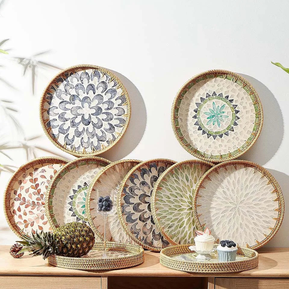 Handcrafted rattan serving tray with mother of pearl inlay featuring a decorative floral pattern.