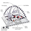 A baby play gym featuring safe arches and various rattles including cloud, sun, star, and moon rattles on a colorful pad.