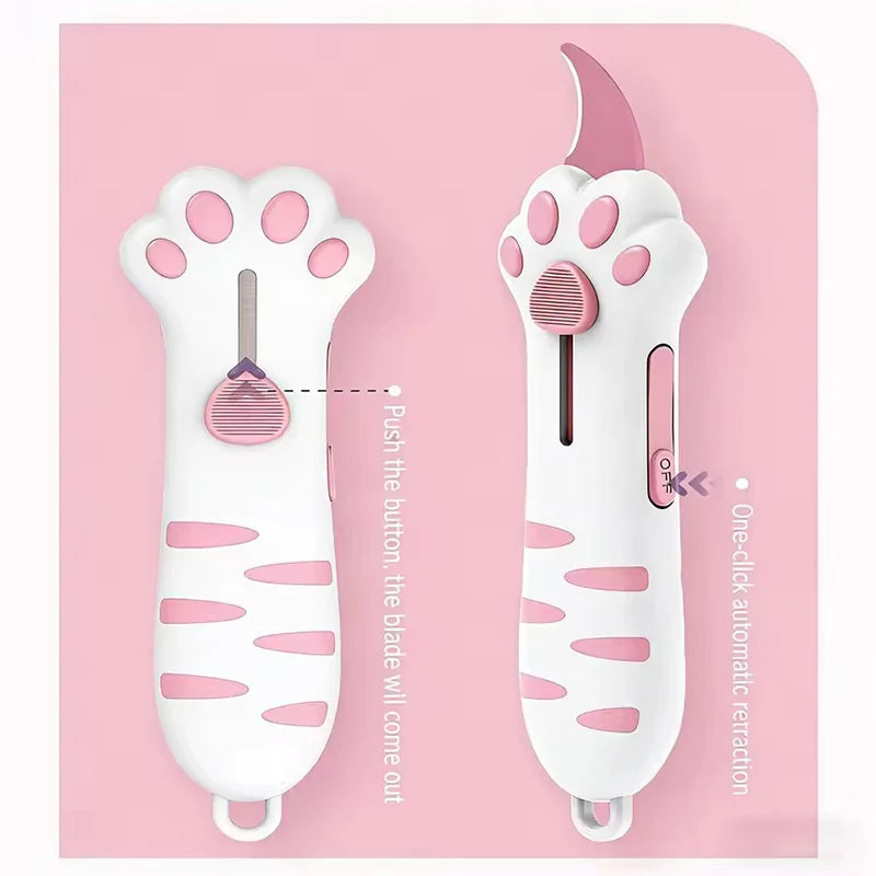 A white retractable cat paw utility knife with pink accents shown against a pink background.