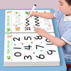 A child is using a reusable magic tracing workbook to practice handwriting, drawing letters and numbers.