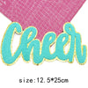 Turquoise glitter chenille letter patch spelling Cheer on pink graph paper