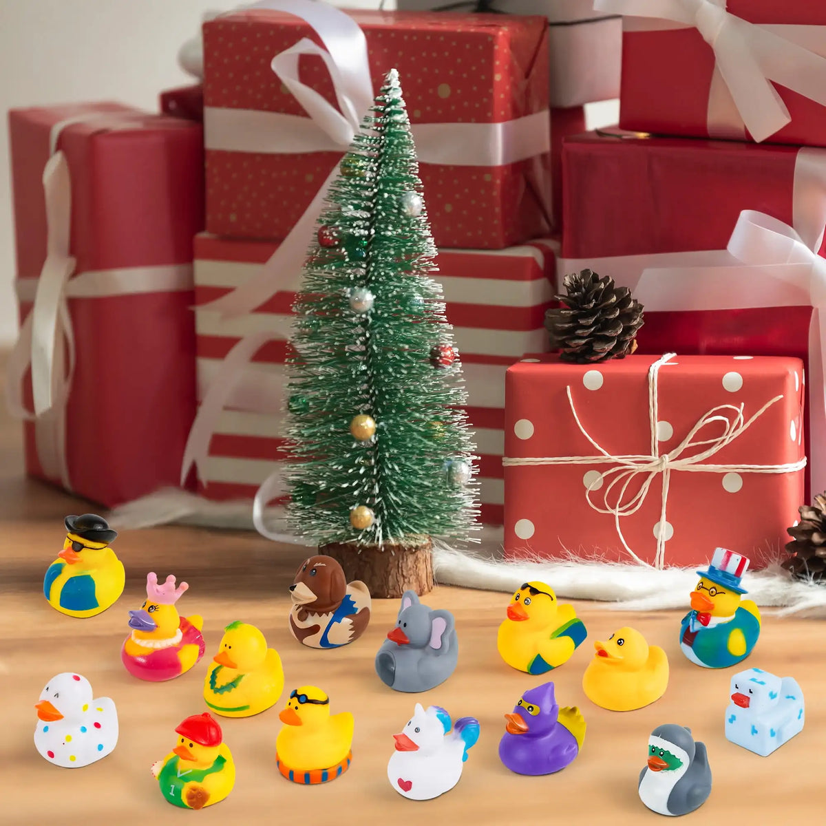 A variety pack of small rubber ducks in yellow, green, purple, and white colors scattered on a wooden surface.