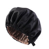 Black satin sleep bonnet with a gathered top and a visible brown lining.