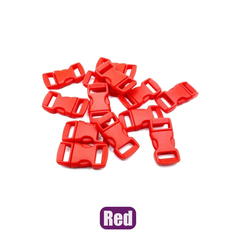 A pile of red plastic side-release buckles for paracord bracelet projects.