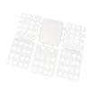 A white magic clothes folding board with multiple compartments for organizing t-shirts.