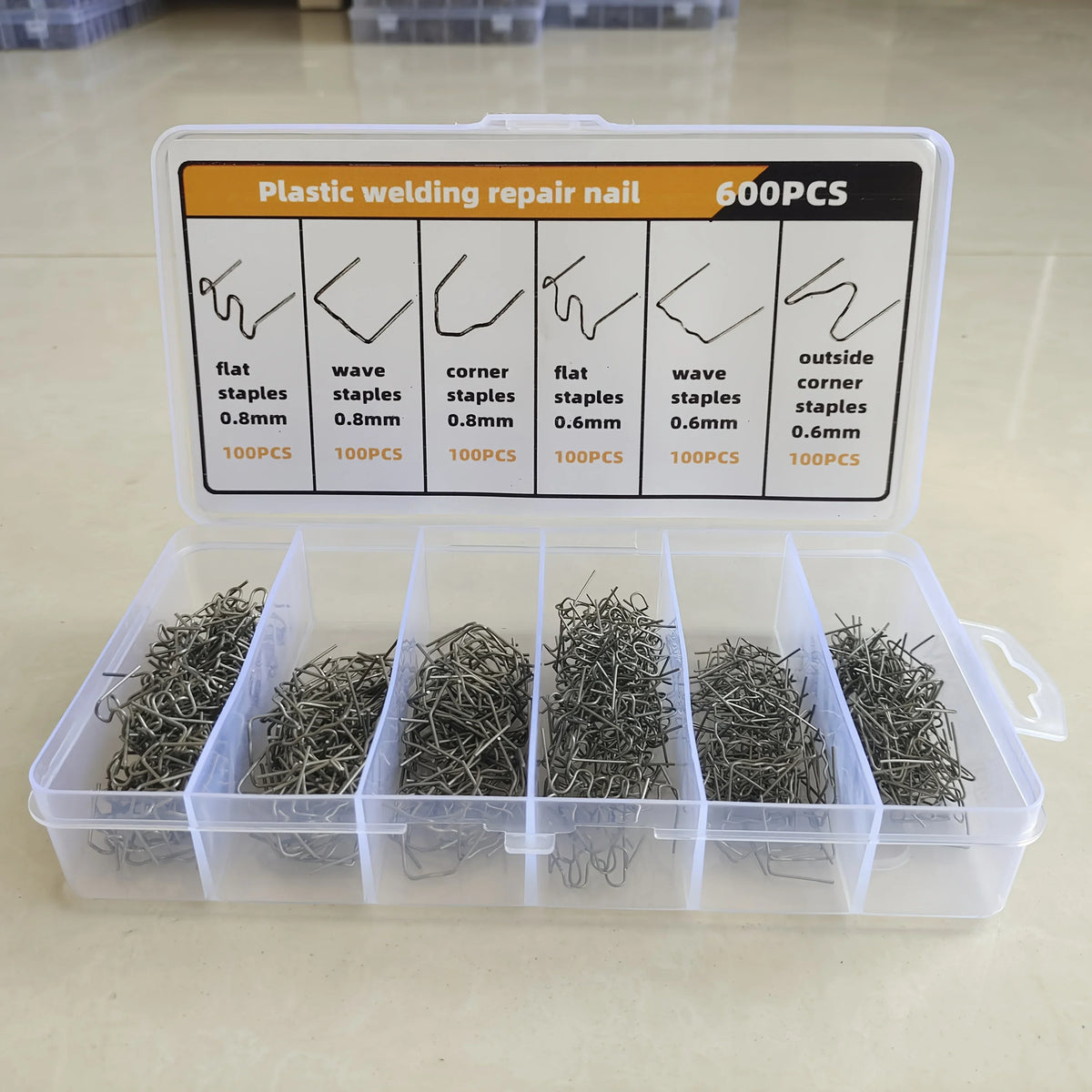 A plastic welding repair nail kit showing various sizes and types of staples for plastic bumper repair.