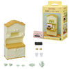A Sylvanian Families Forest Friends gift set featuring a kitchen display cabinet and various food items.