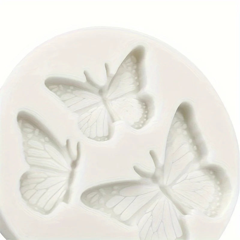 White silicone molds shaped like butterflies for crafting candles, clay, and resin