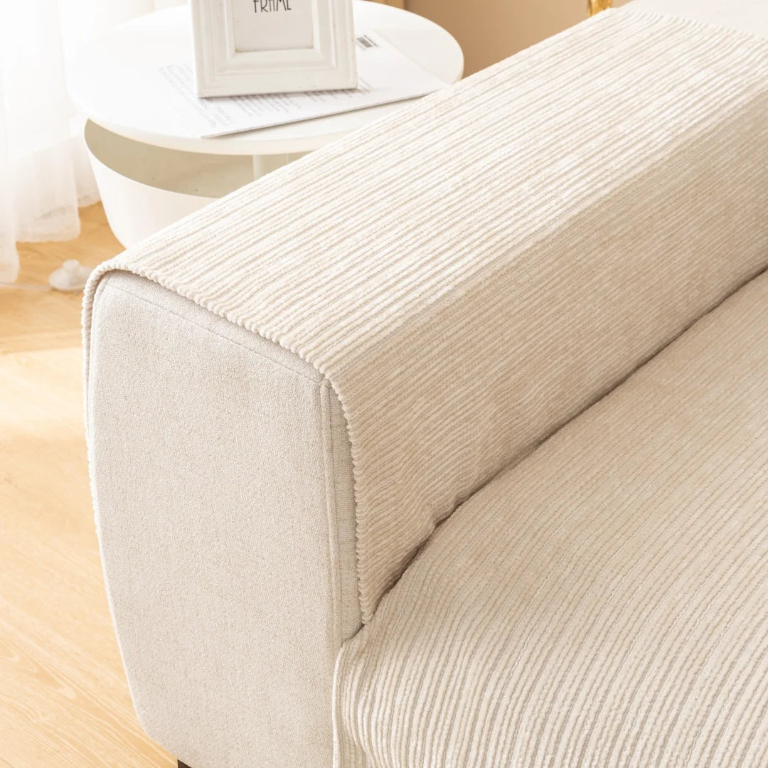 A close-up of a beige geometric sofa cushion cover with vertical ribbing.