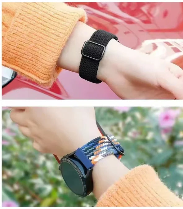 A close-up of a wrist wearing a black quick-release braided nylon watch band next to an orange knitted sleeve.