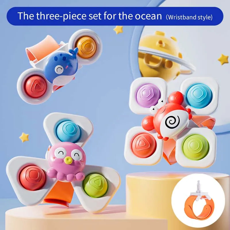 A three-piece set of spinning top fidget toys with wristband style components in various colors.