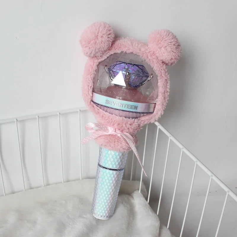 A pink fluffy plush cover for a SEVENTEEN official light stick is displayed against a white background.