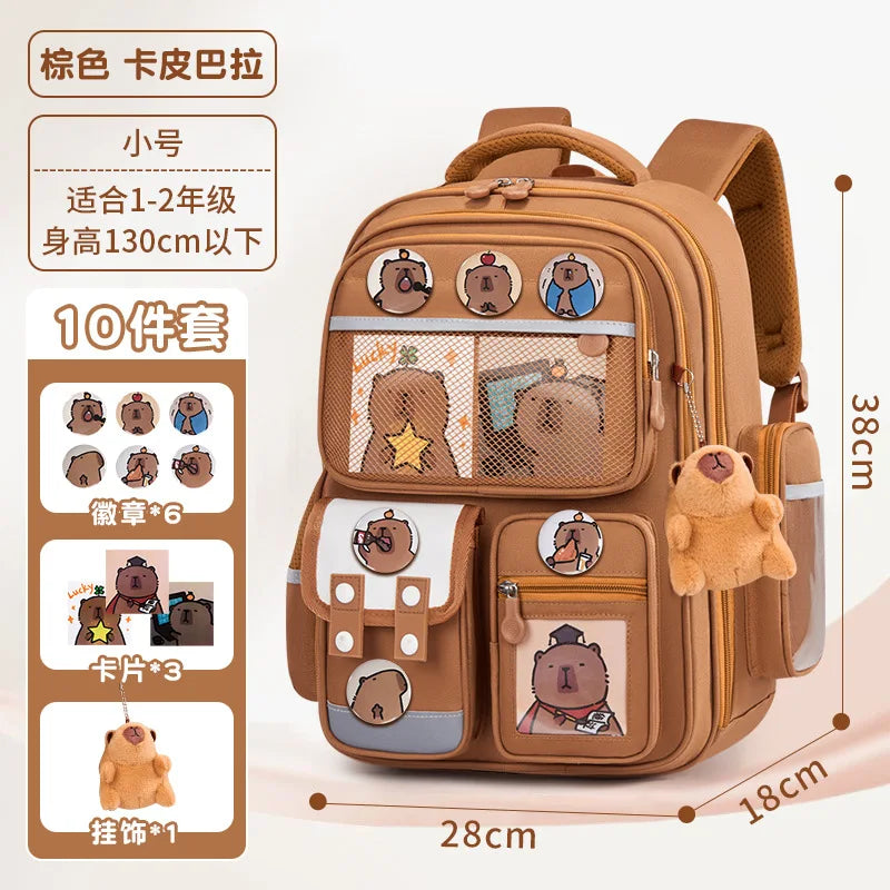 A tan backpack featuring various capybara-themed patches and compartments for children.