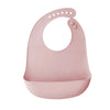 A pink ultra-thin silicone baby bib with a catch pocket for feeding