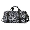 A black and white leopard print travel tote bag with shoulder straps.