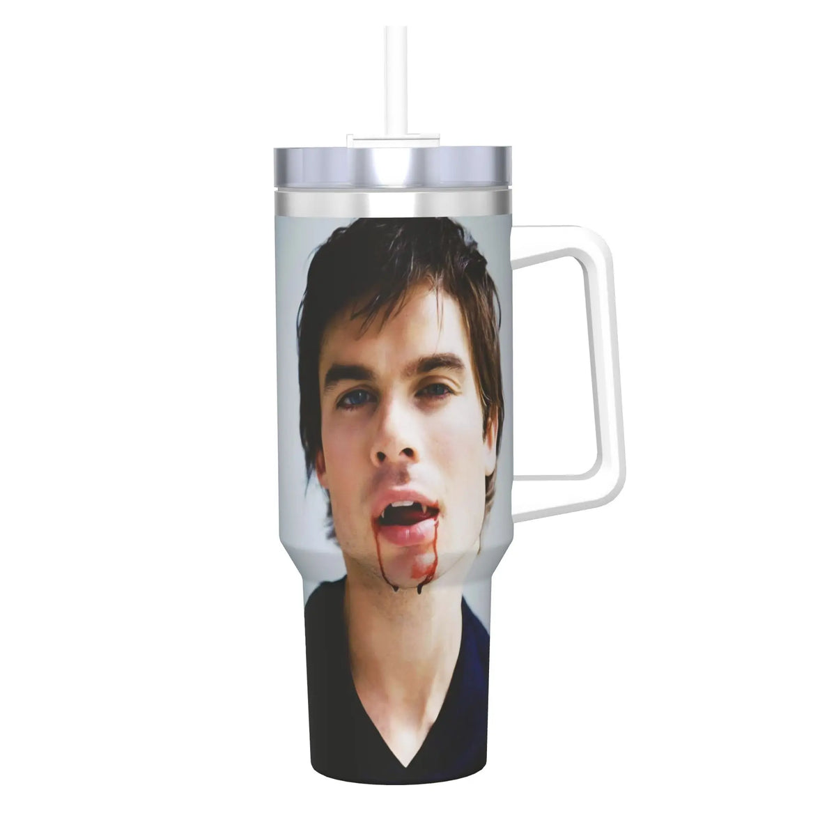 A clear insulated stainless steel tumbler with a silver straw lid featuring a portrait of a man with blood dripping from his 