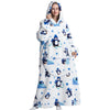 A woman wearing an oversized white and blue penguin-themed wearable blanket hoodie with a hood