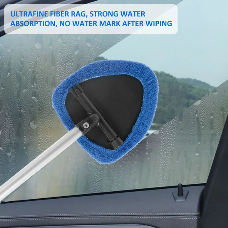 Extendable car windshield cleaner with a blue microfiber pad being used to wipe water marks off glass.
