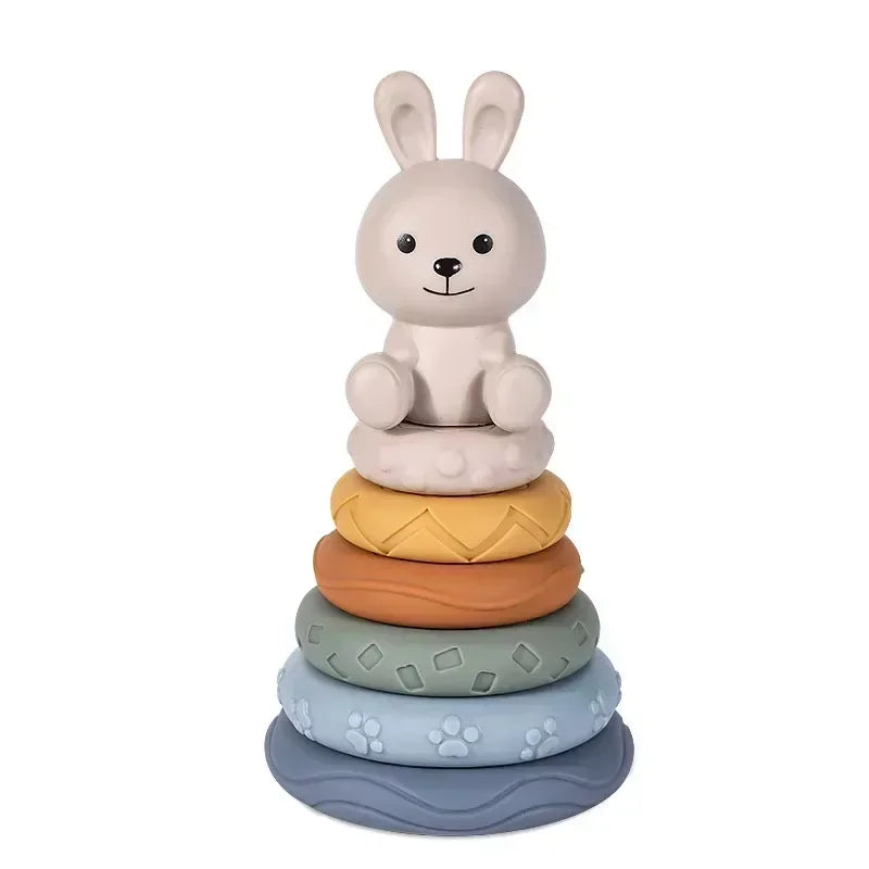 A light beige silicone rabbit shaped building block with a round base.