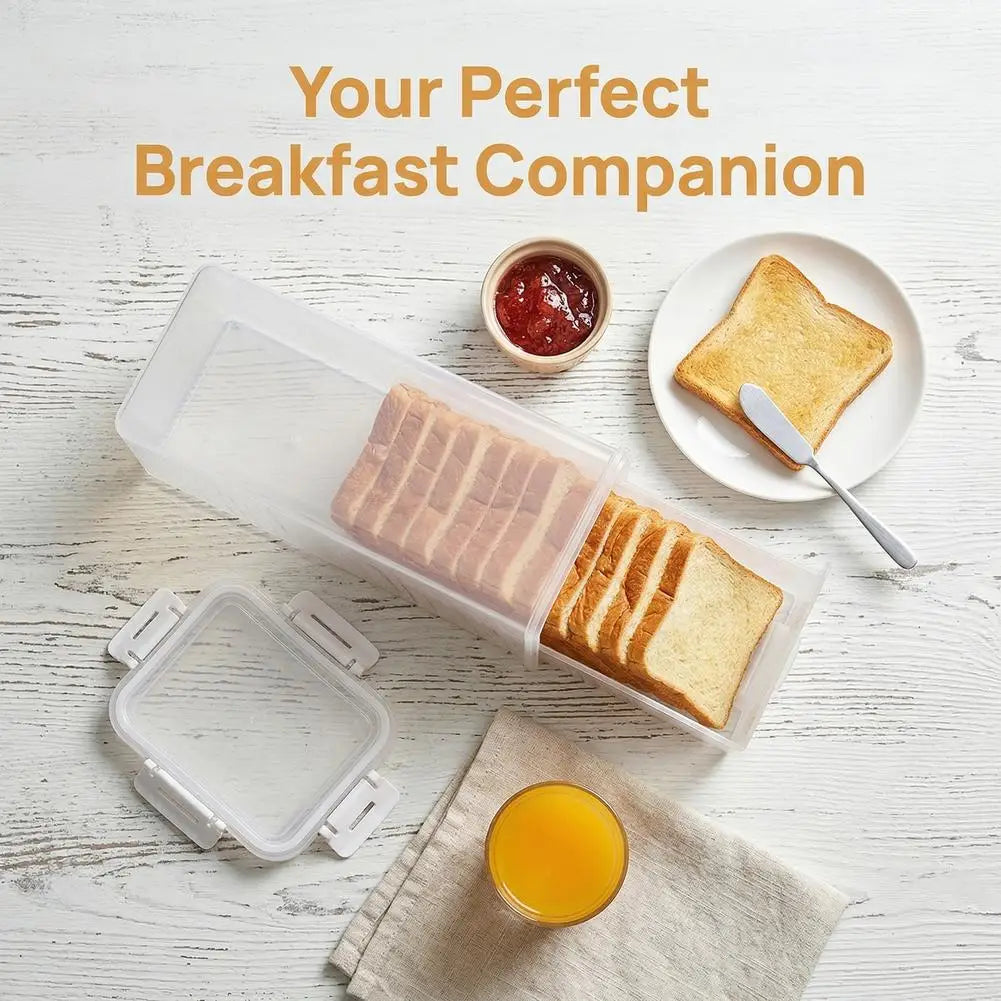 A clear airtight bread box containing sliced bread and a glass of orange juice on a white wooden surface.