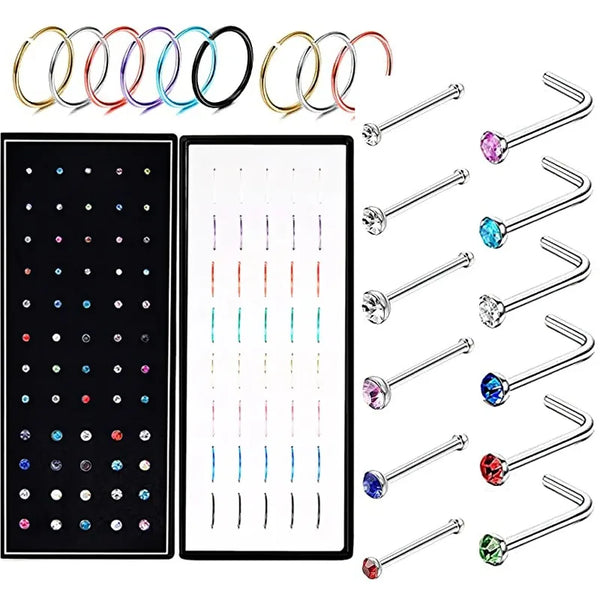 A set of geometric stainless steel nose studs and ear piercings.
