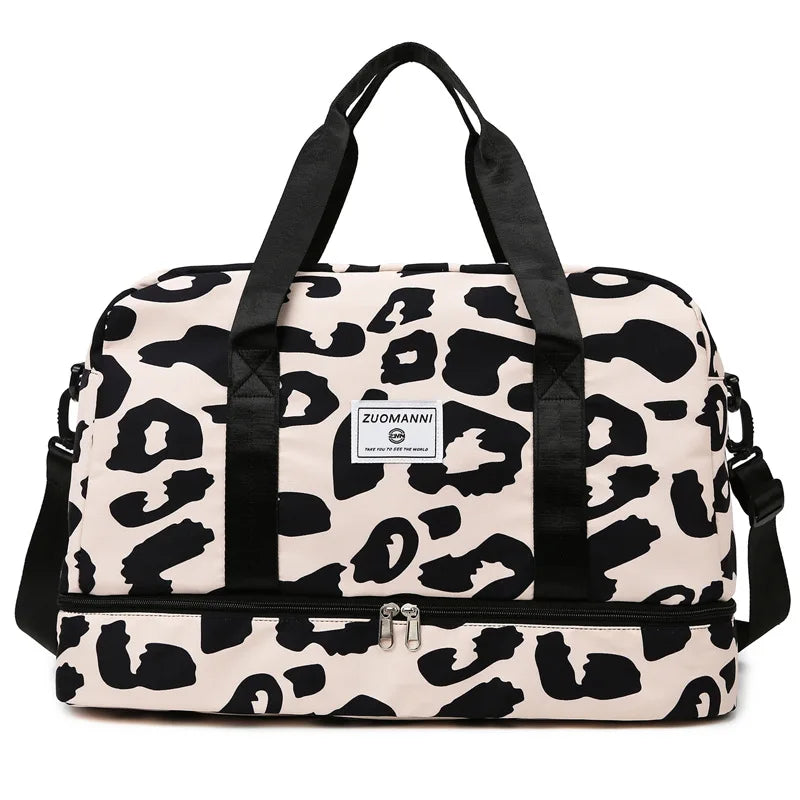 A beige and black leopard print duffle bag with black straps and wet/dry compartments.