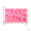 Pink silicone mold shaped like butterflies and moths for crafting