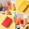 Assorted velvet jewelry gift boxes in pink, yellow, and red with cushioned inserts displayed on a light surface.
